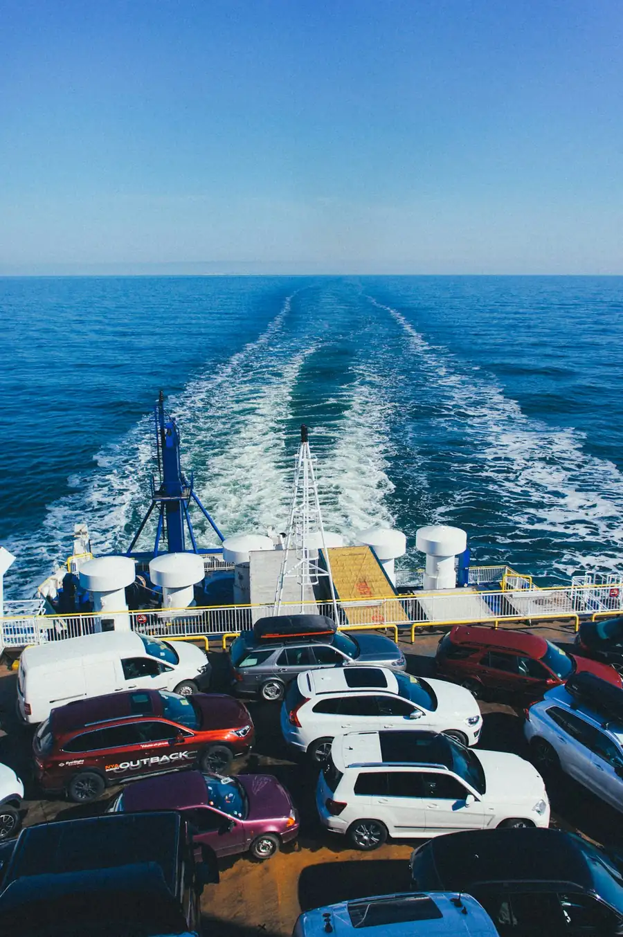 Rows of vehicles on the deck of a car carrier ship at sea